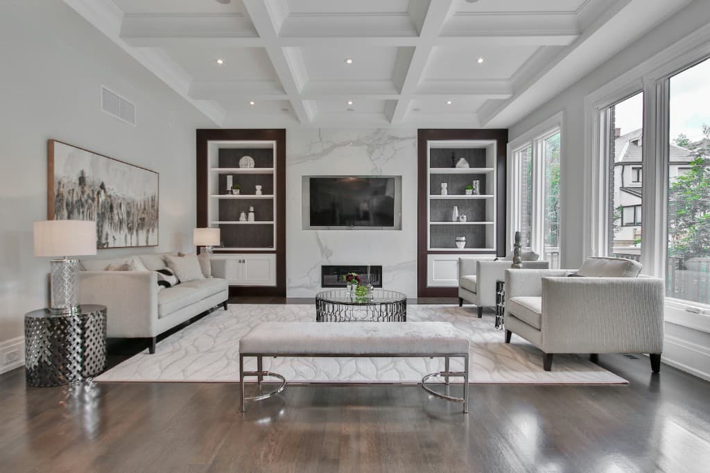 Luxury living room with marble feature wall, fireplace, and floor-to-ceiling windows — Vilano Ikoyi